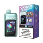Oxbar DualBlend 50K vape held in adult hand for size reference